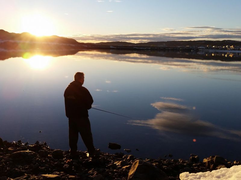 Person fishing in Arctic waters